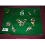 A board of ten costume Brooches