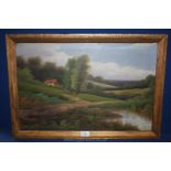 A framed Oil on canvas of a Country landscape depicting a cottage by a pond with hills in the