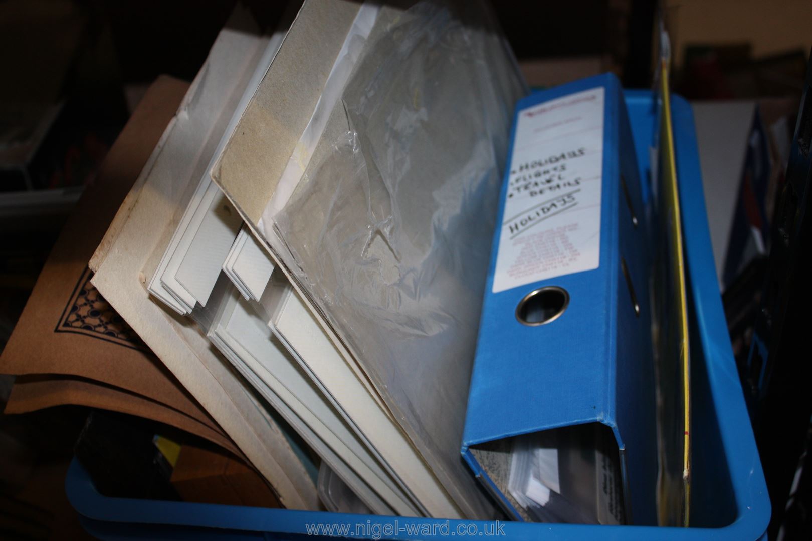A crate of mounted Studio Photographs, etc.