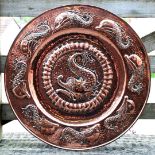 A large Pool of Hayle Copper Charger with central dolphin plus eight dolphins to circumference,