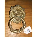 A brass Lion's head Door Knocker