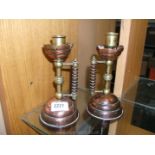 A pair of Copper and brass Arts and Crafts Candlesticks ,