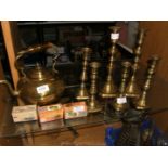 Three pairs of Brass Candlesticks,