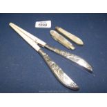 A pair of Ivory and Silver Glove Stretchers and two Mother of Pearl Fruit Knives