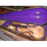 A Violin, in coffin style antique case.