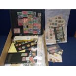 A box of loose stamps, World mix, contains a variety of album sheets, club books, covers,