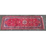 A red ground Persian Sorok mear Runner,