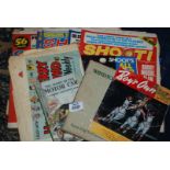 A bag of old comics and football magazines