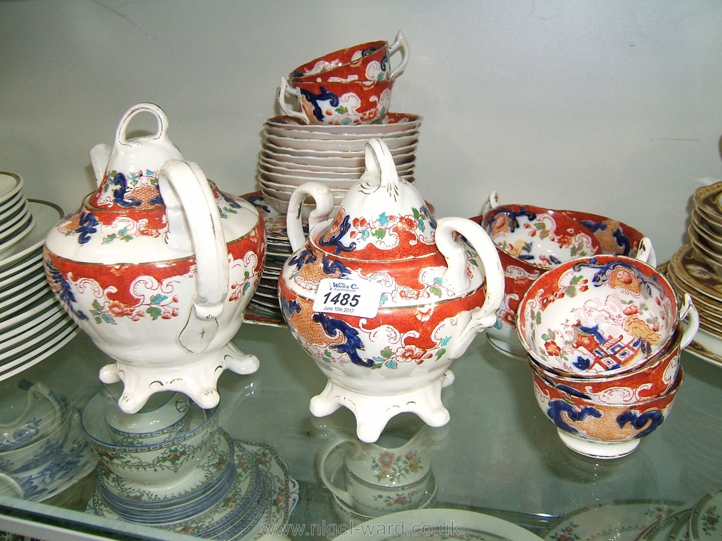 A Royal Stafford Teaset with chinoiserie decoration including teapot, sucrier, seven cups,