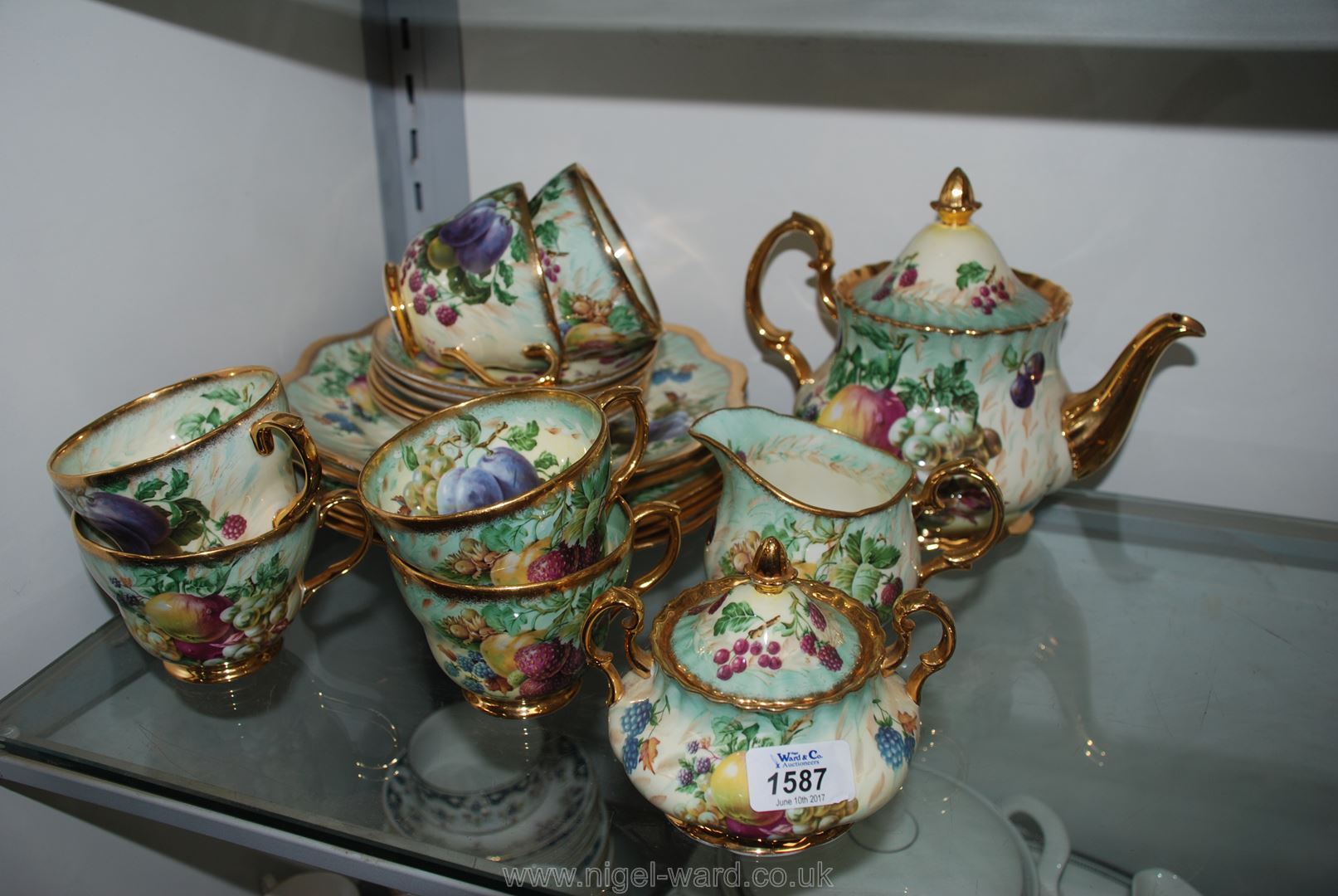 A Raymond Everill 'Princess Royal' Tea Service, fruit decorated, including teapot, sugar bowl,