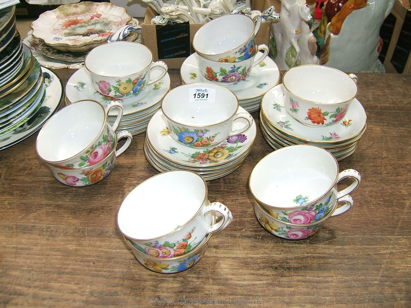 A Dresden part Teaset, with pretty floral hand painted decoration, comprising 11 cups,
