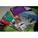 A bag of Illustrated Family Encyclopedia Volumes