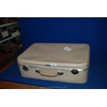 A vintage Antler ladies Suitcase with peach satin quilted interior.