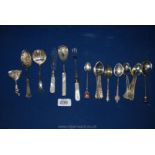 Miscellaneous EPNS spoons and a silver caddy spoon with embossed decoration