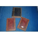 Three leather bound bibles