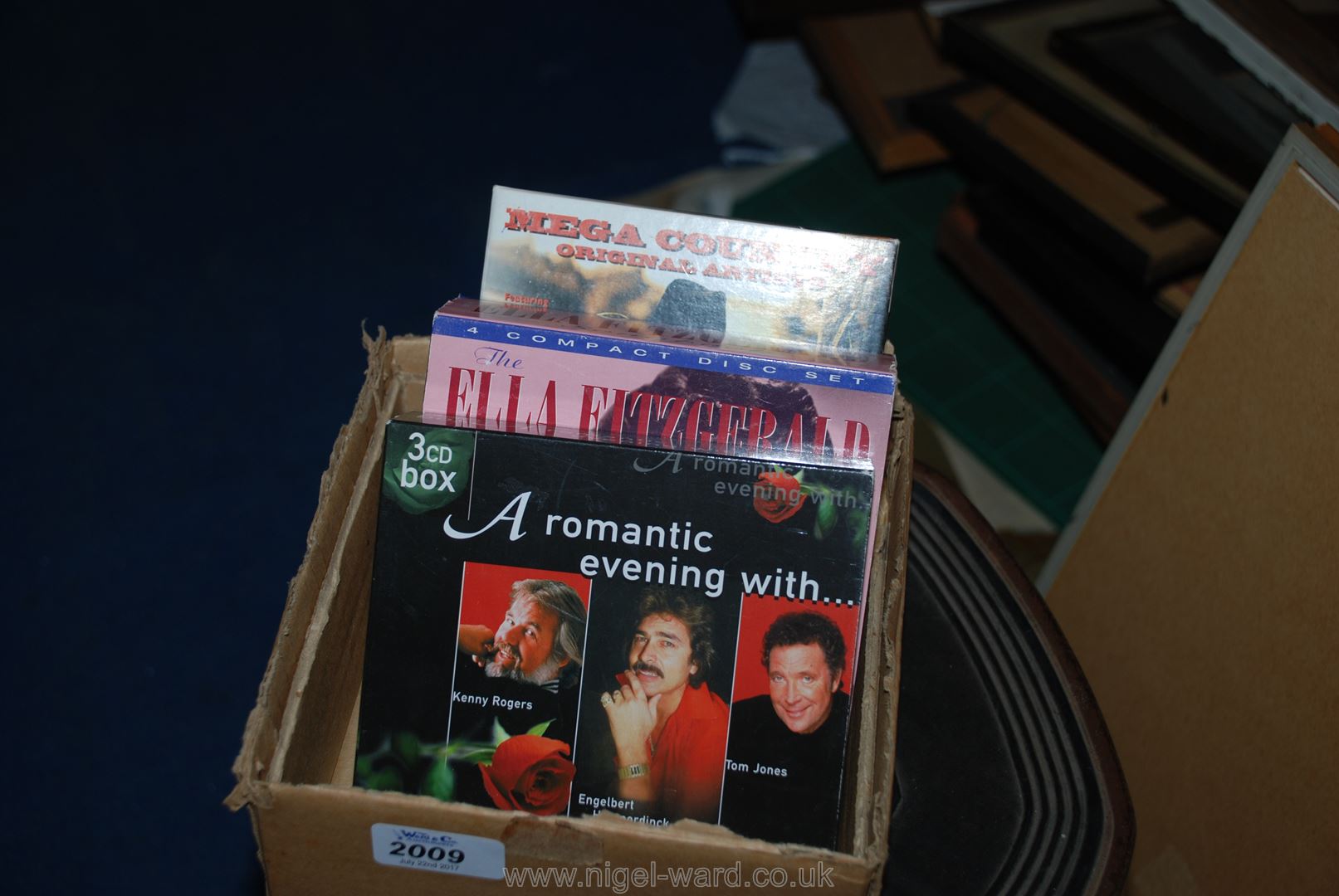 a box of three CD boxed set inc mega country, Ella Fitzgerald, Kenny Rogers,