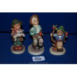 Three Goebel figures including a boy with umbrella, 'Apple Tree Boy',