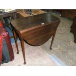 A Georgian style Mahogany oval drop-leaf Occasional Table on tapering turned legs terminating in