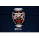 A Royal Crown Derby pot in imari style with decorative panel of to exotic birds,