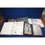 A box containing an Album of UK presentation packs and First Day Covers, Stamp Album from Malta, US,