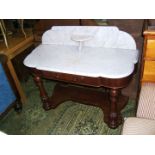 A Victorian marble topped Duchess style Washstand with lower tier.