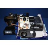 A collection of cameras and accessories including an Ansco camera, Polaroid land camera,