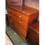 A Victorian Pine Chest of two short over three long graduated Drawers with turned knobs and