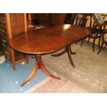 A reproduction Georgian style Mahogany double 'D' end extending twin pedestal Dining Table with