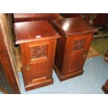 A mirrored pair of Walnut Bedside Cabinets having moulded edge tops over two-panel doors with