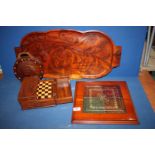 A large carved wooden Tray depicting fish and pond flowers to both sides,