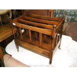 A reproduction Mahogany Canterbury with ball finials and single drawer.