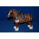 A Beswick Brown Bay Shire horse with tack in matt finish