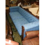 A William IV Walnut show frame Sofa upholstered in blue ground floral shadow patterned fabric and