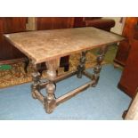 A period Oak Side Table having a one piece rectangular top on baluster turned legs with stretchers