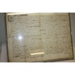 An indenture of Queen Anne's reign relating to Casterton in Westmoreland, framed.