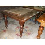 An Edwardian Walnut wind-out extending Dining Table with two extra leaves, canted corner top,