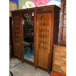 A substantial Edwardian Mahogany triple door fitted Wardrobe,