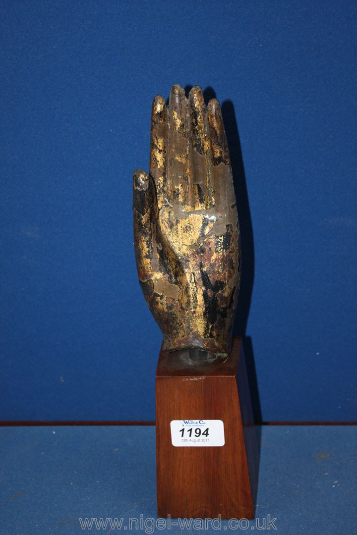 An early Thai Ayutthaya bronze Buddha hand 15th -17th century with extensive remains of black