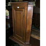 A 19th c. Oak wall hanging Corner Cabinet with chevron inlaid single panel door.