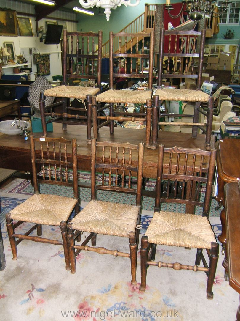 A matched set of six Ash and Oak framed spindle back rush seated Clissett Chairs.