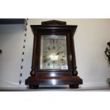 A large Mahogany cased Mantle Clock striking on a set of gongs,