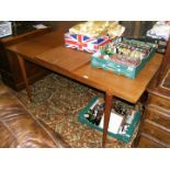 A Christian Linneberg Teak extending Dining Table with middle leaf having alternative grain,