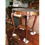 A late Victorian Mahogany lozenge top Occasional Table with carved shoulder cabriole style legs and