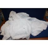 A quantity of linen including Victorian cotton including night dresses, petticoats, plus tablecloth,