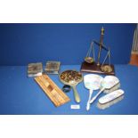 A small set of brass Postal Scales to weigh 50 grams, wooden cribbage board, hand mirror, brush,