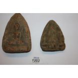 Two very early terracotta votive plaques,