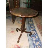 A Georgian Mahogany Occasional Table, the circular top with moulded lipped edge,