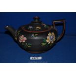 A fine 19th century Wedgwood Capri ware teapot, black basalt enameled with Chinese flowers,