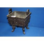 An oriental Bronze rectangular Censor on four long legs,