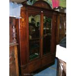 An Edwardian double Wardrobe with pediment top,